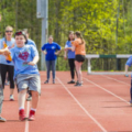 Students running relay race.