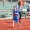 Student running on track.