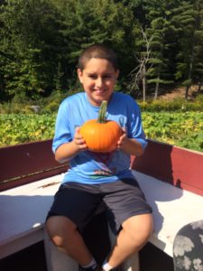 Student with his pumpkin.
