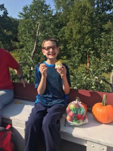 Student enjoying an apple.