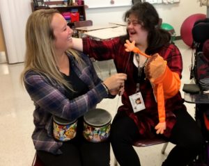 Student and staff singing with the Beatles Puppets.