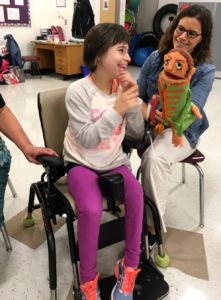 Student and staff singing with the Beatles Puppets.