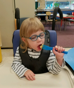 Student feeding themself.