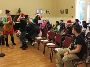 Students caroling at the Senior Center.