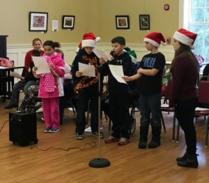 Students caroling at the Senior Center.