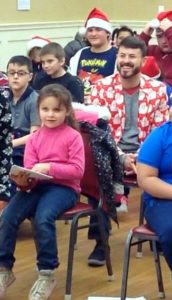Students caroling at the Senior Center