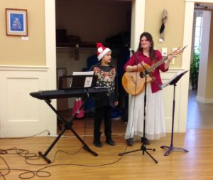 Students caroling at the Senior Center