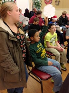 Students caroling at the Senior Center